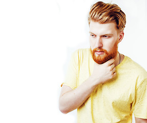 Image showing young handsome hipster ginger bearded guy looking brutal isolate