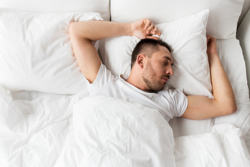 Image showing man sleeping in bed at home