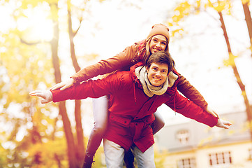 Image showing happy young couple having fun in autumn park