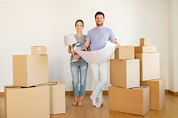 Image showing couple with boxes and blueprint moving to new home