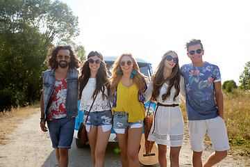 Image showing smiling happy young hippie friends and minivan car