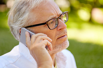 Image showing senior man in glasses calling on smartphone