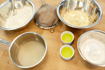 Image showing bowls with flour and egg whites at bakery kitchen