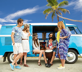 Image showing hippie friends with tom-tom playing music over car