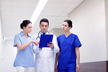 Image showing group of medics at hospital with clipboard