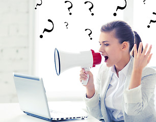 Image showing strict businesswoman shouting in megaphone