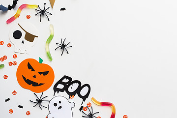 Image showing halloween party paper decorations and sweets