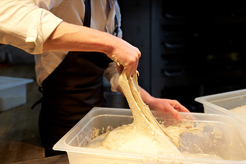 Image showing chef or baker cooking dough at bakery