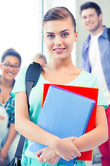 Image showing student girl with school bag and notebooks