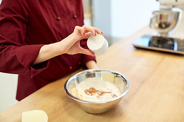 Image showing chef with flour in bowl making batter or dough