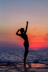 Image showing Dance at sunset. Vertical image