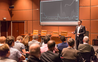 Image showing Business speaker giving a talk at business conference event.