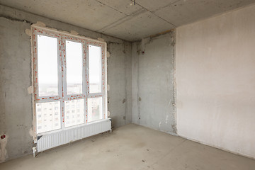 Image showing Interior of an empty building with a large stained-glass window in a new building