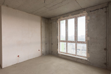 Image showing Large stained glass window and plastered wall in a new building