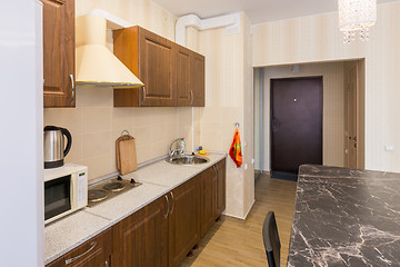 Image showing Interior of modern kitchen and entrance to the apartment