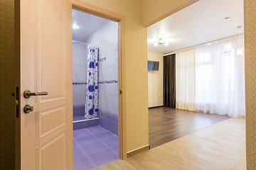 Image showing Interior of studio apartment, open door to the bathroom and view of the room