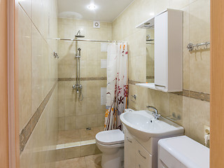 Image showing Interior of a small combined bathroom