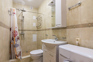 Image showing Interior of a small combined bathroom