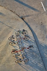 Image showing Bicycles stand on a street