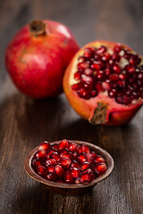 Image showing Pomegranate fruit on wooden vintage background