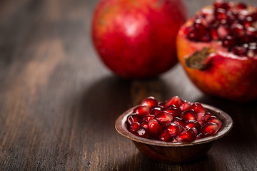 Image showing Pomegranate fruit on wooden vintage background