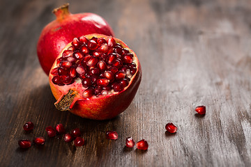 Image showing Pomegranate fruit on wooden vintage background