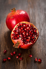 Image showing Pomegranate fruit on wooden vintage background