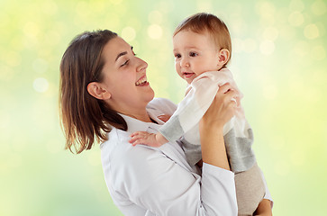 Image showing happy woman doctor or pediatrician with baby