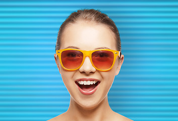 Image showing happy teenage girl or woman face in shades