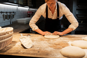 Image showing chef or baker making dough at bakery