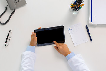 Image showing doctor with tablet pc and prescription at clinic