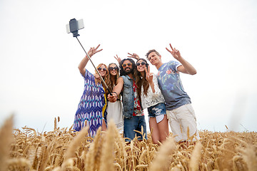 Image showing hippie friends with smartphone on selfie stick