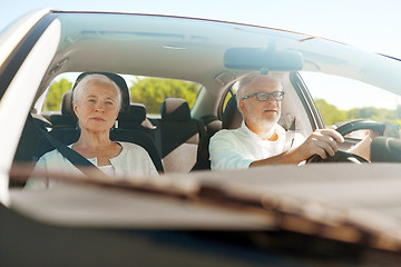 Image showing happy senior couple driving in car