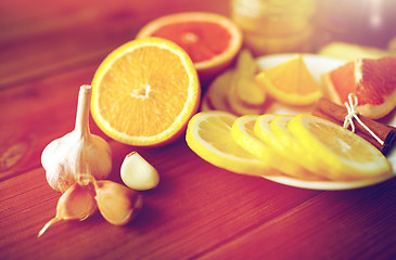 Image showing garlic, lemon, orange and other folk remedy