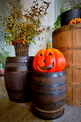 Image showing Pumpkins on old barrel