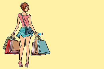 Image showing Young woman with shopping bags on sale