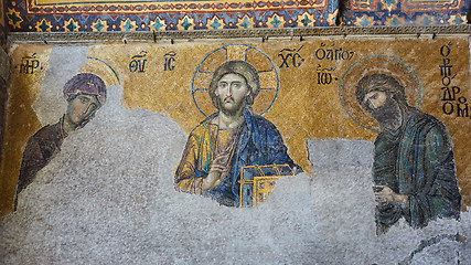 Image showing 13th century Deesis Mosaic of Jesus Christ flanked by the Virgin Mary and John the Baptist in the Hagia Sophia temple in Istanbul, Turkey.