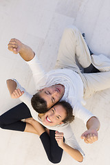 Image showing couple sitting with back to each other on floor