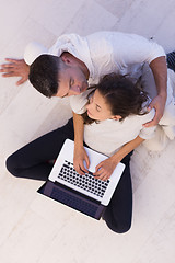 Image showing couple using tablet and laptop computers top view