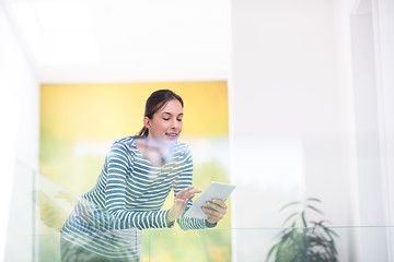 Image showing young woman at home websurfing