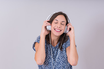 Image showing woman with headphones isolated on a white