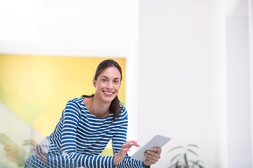 Image showing young woman at home websurfing