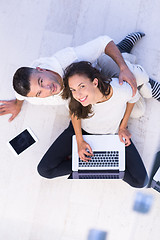 Image showing couple using tablet and laptop computers top view