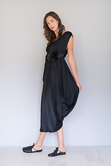Image showing woman in a black dress isolated on white background