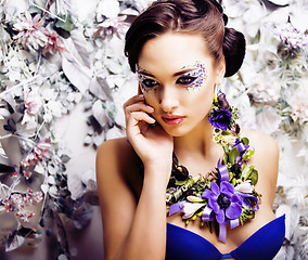 Image showing floral face art with anemone in jewelry, sensual young brunette 