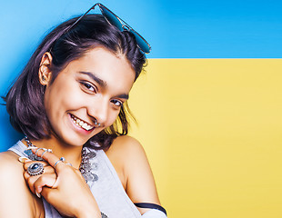 Image showing lifestyle people concept. young pretty smiling indian girl with long nails wearing lot of jewelry rings, asian summer happy cool  copyspace