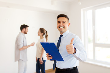 Image showing realtor with clipboard showing thumbs up