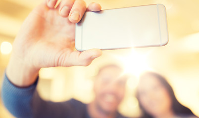 Image showing close up of couple taking smartphone selfie