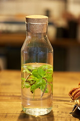 Image showing fruit water with peppermint in glass bottle