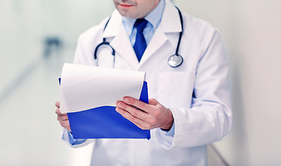 Image showing close up of doctor with clipboard at hospital